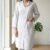 pomelli_photoshoot-24 โ
Premium Coat Collar Front Open Kurti Trouser Co-Ord Set Round Daman With Pockets For Women Off White